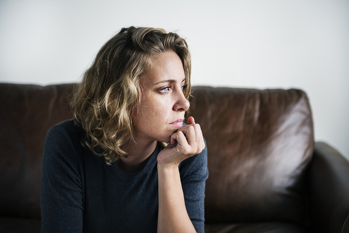 woman wondering about the signs of addiction