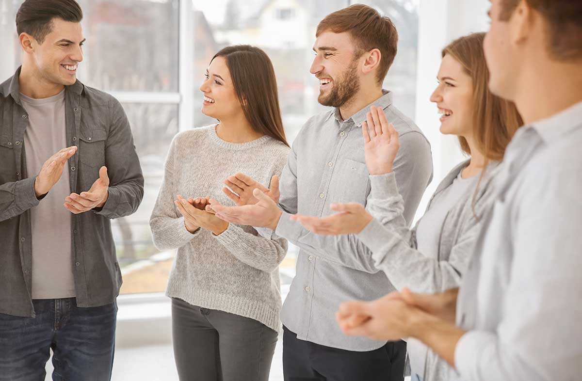 people clapping at small wins in recovery