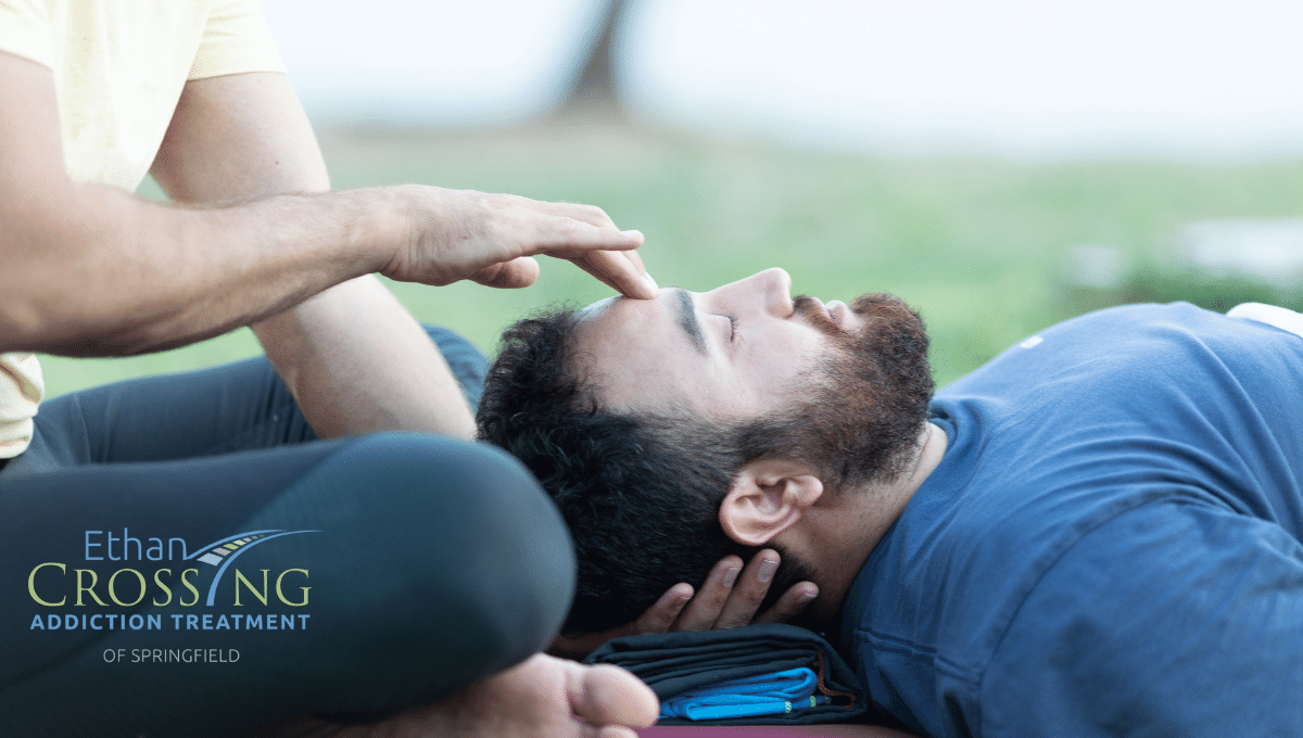 man receiving yoga therapy